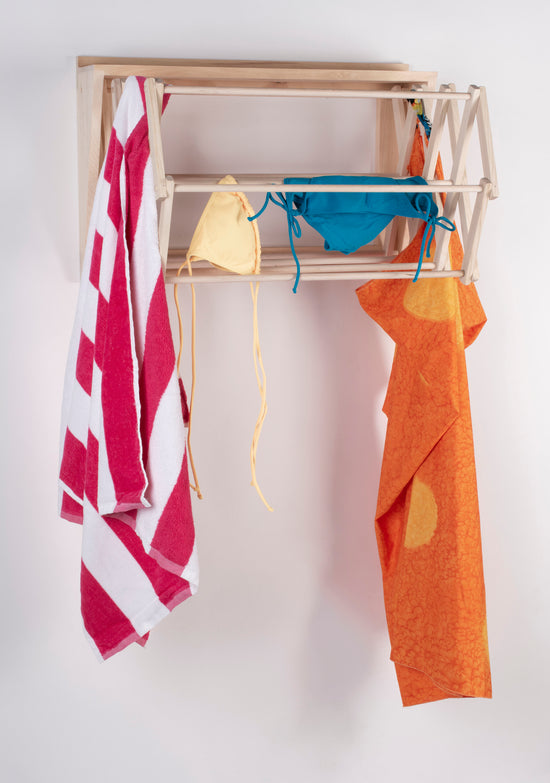 Poolside towel and wet bathing suit drying rack made by Dahl and Company. $175.00
